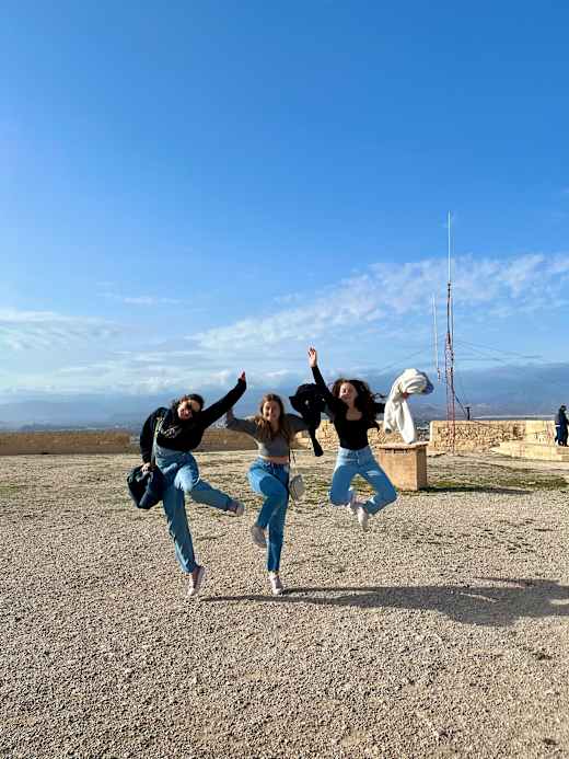 Girls jumping in air.