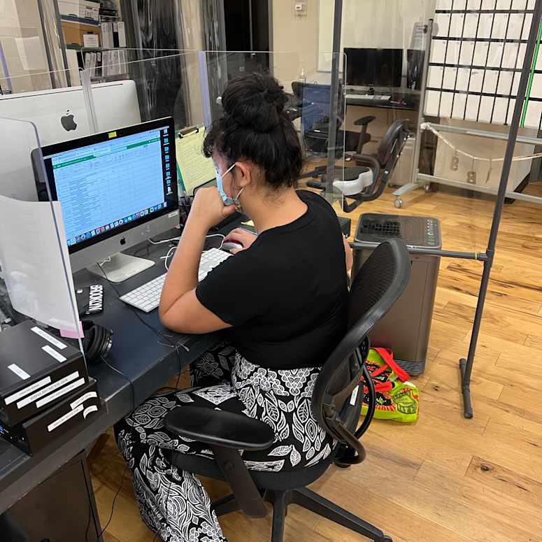 A student working at a desktop computer.