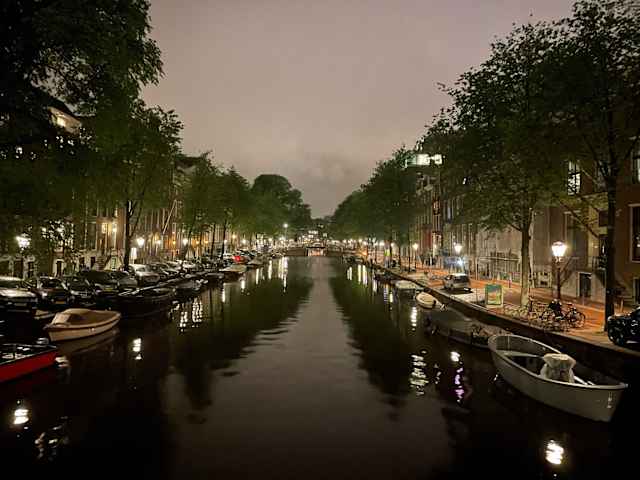 Canal lights in Amsterdam during the evening.