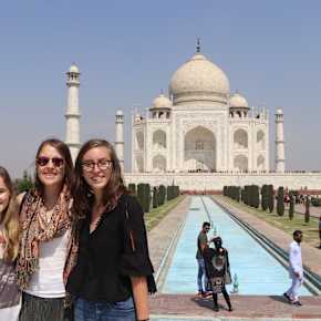 Three students in front of the Taj Mahal in India.