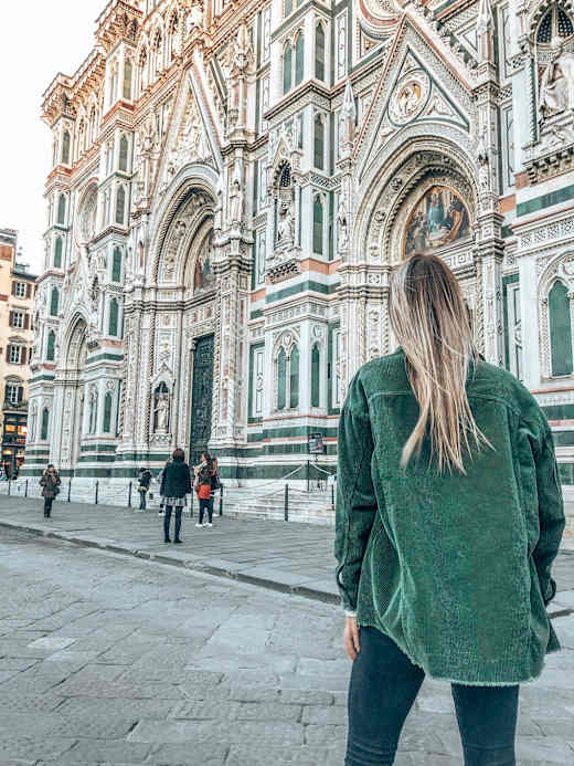 A student walking near the Cathedral of Santa Maria del Fiore in Florence, Italy.