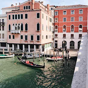 Pinik buildings and gondolas in Italy.