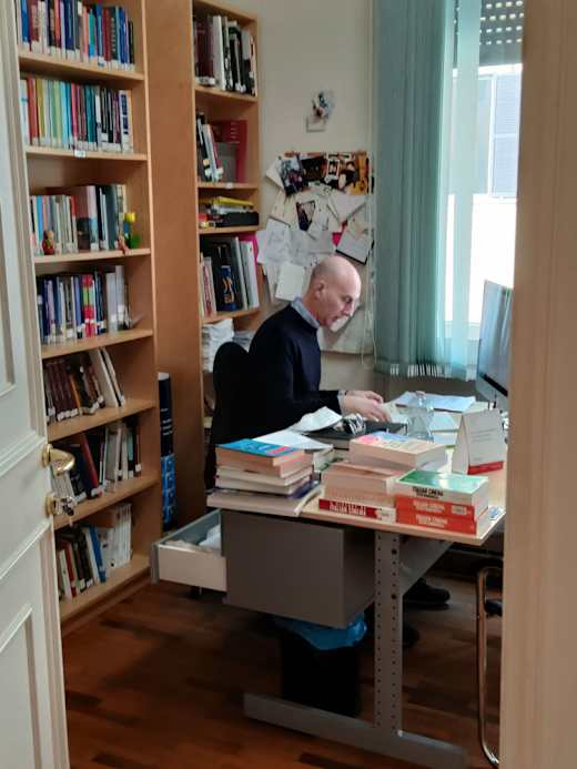 Professor in his office.