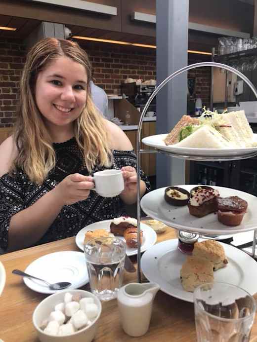 A student having high tea in London.