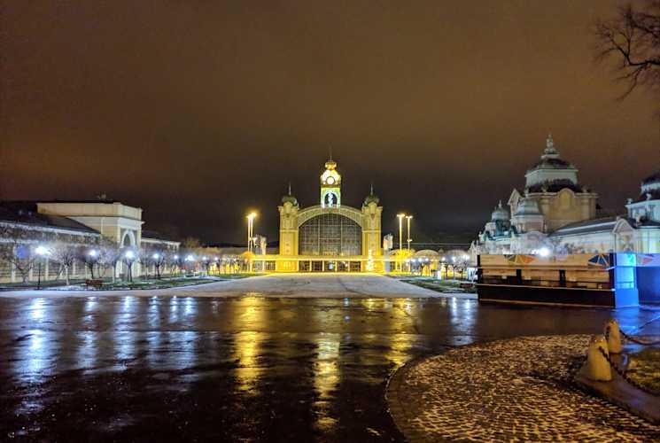 Backlit buildings in Prague at night.