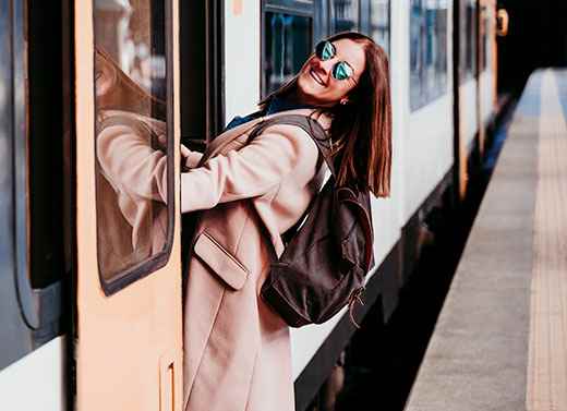 Woman boarding train.